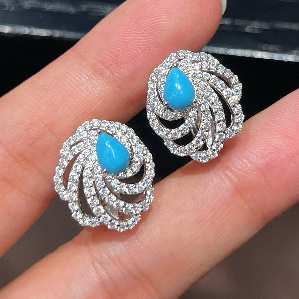 Turquoise Swirl Wing Stud Earrings in 925 Sterling Silver - Handheld View
