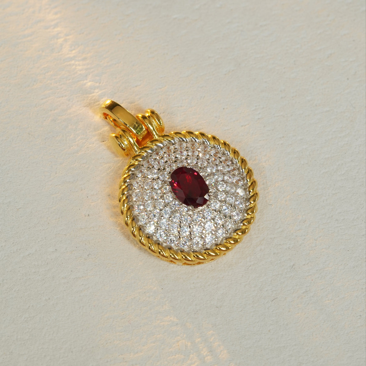 Red oval 5A CZ pavé rope-edge pendant
