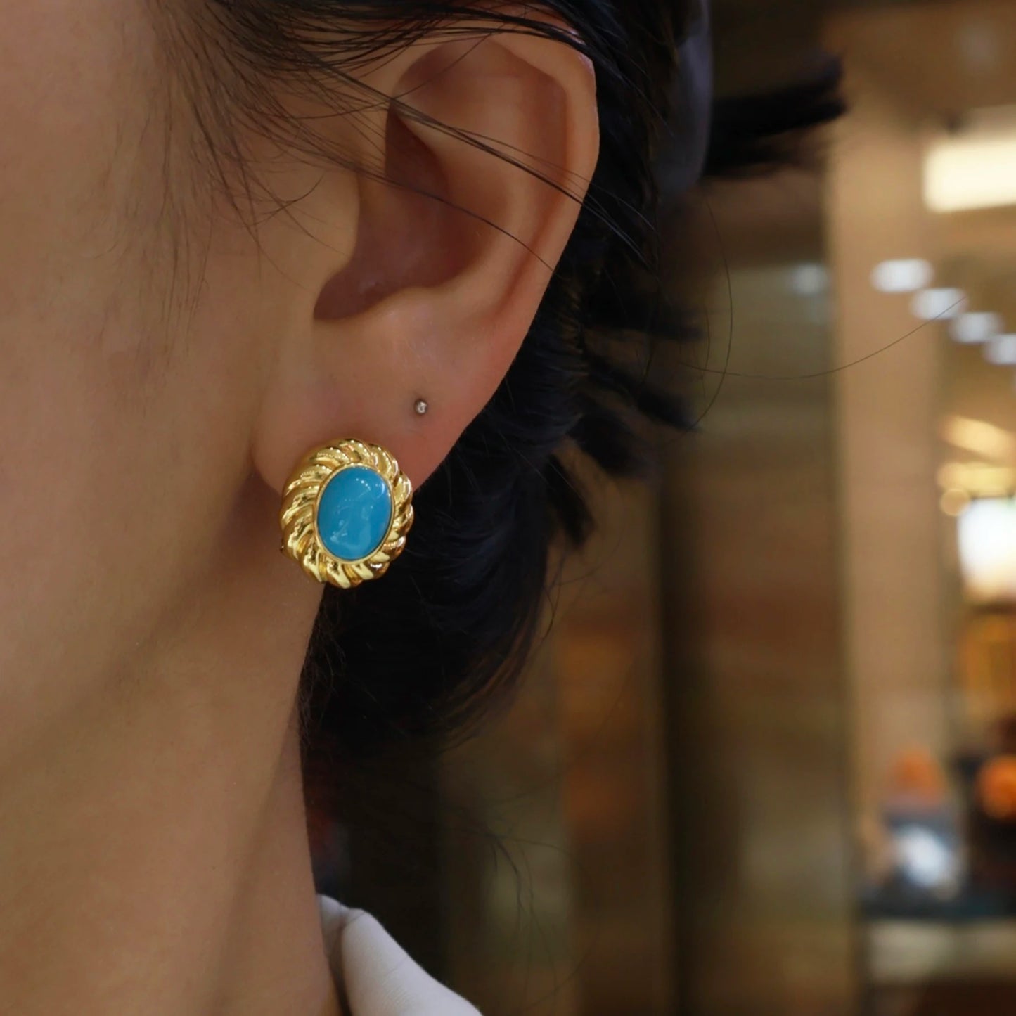 woman wearing elegant turquoise gold stud earrings vintage inspired jewelry