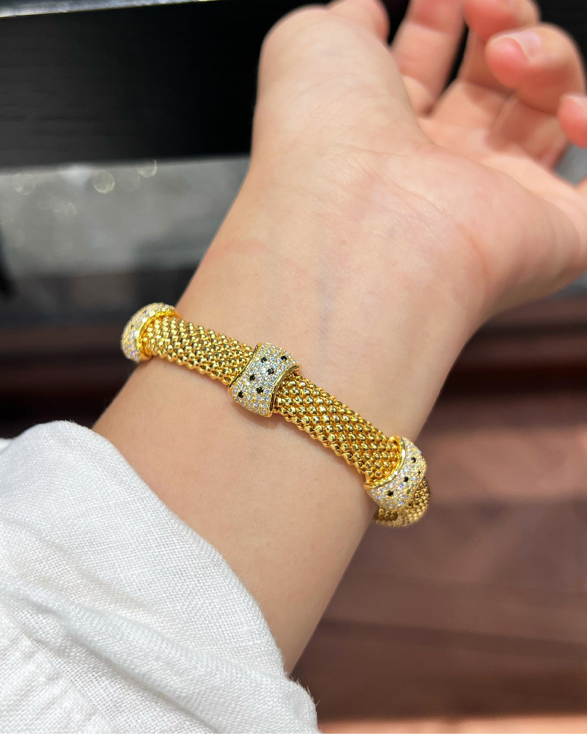 Gold Woven Leopard Cuff Bracelet on Model Wrist - Noble Aurora