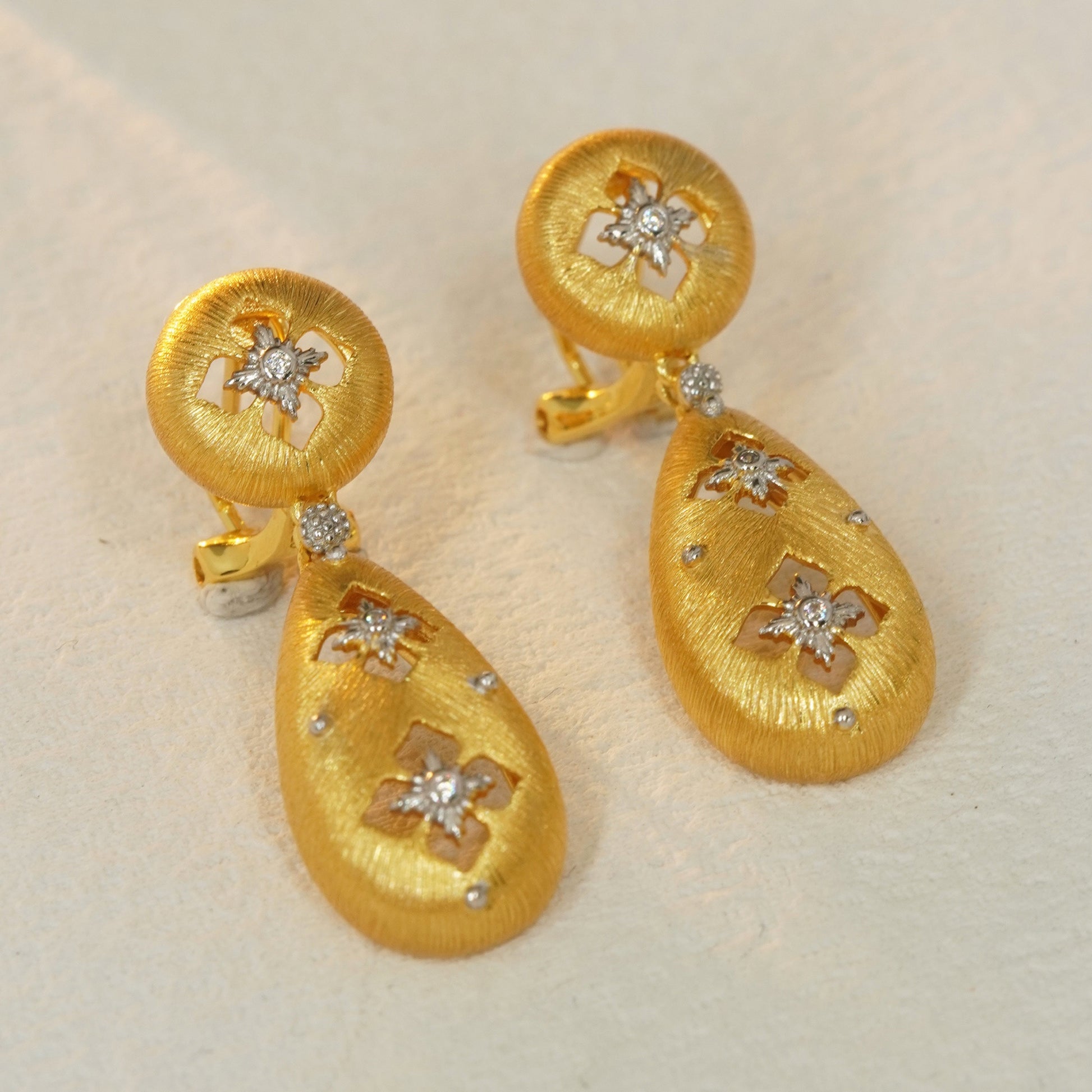 18K gold plated floral teardrop earrings with brushed texture and CZ details