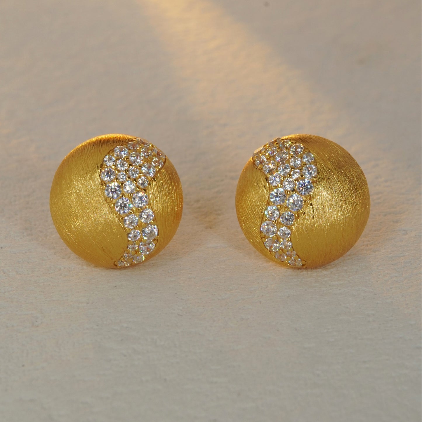 brushed gold CZ accent stud earrings with minimalist round design