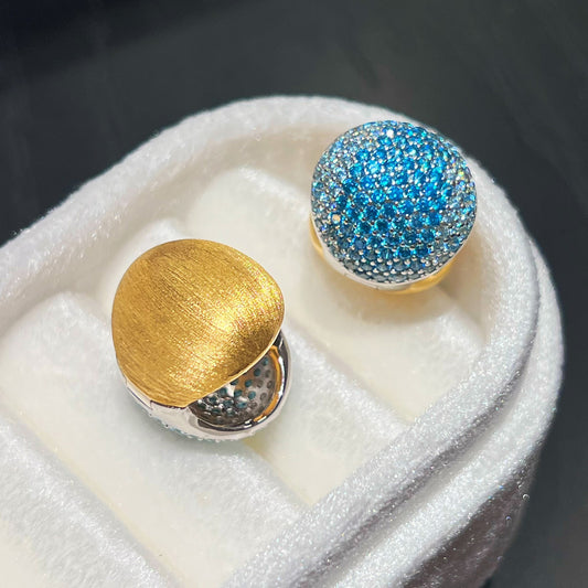 Reversible blue CZ huggie hoop earrings with 18K gold plated sterling silver design