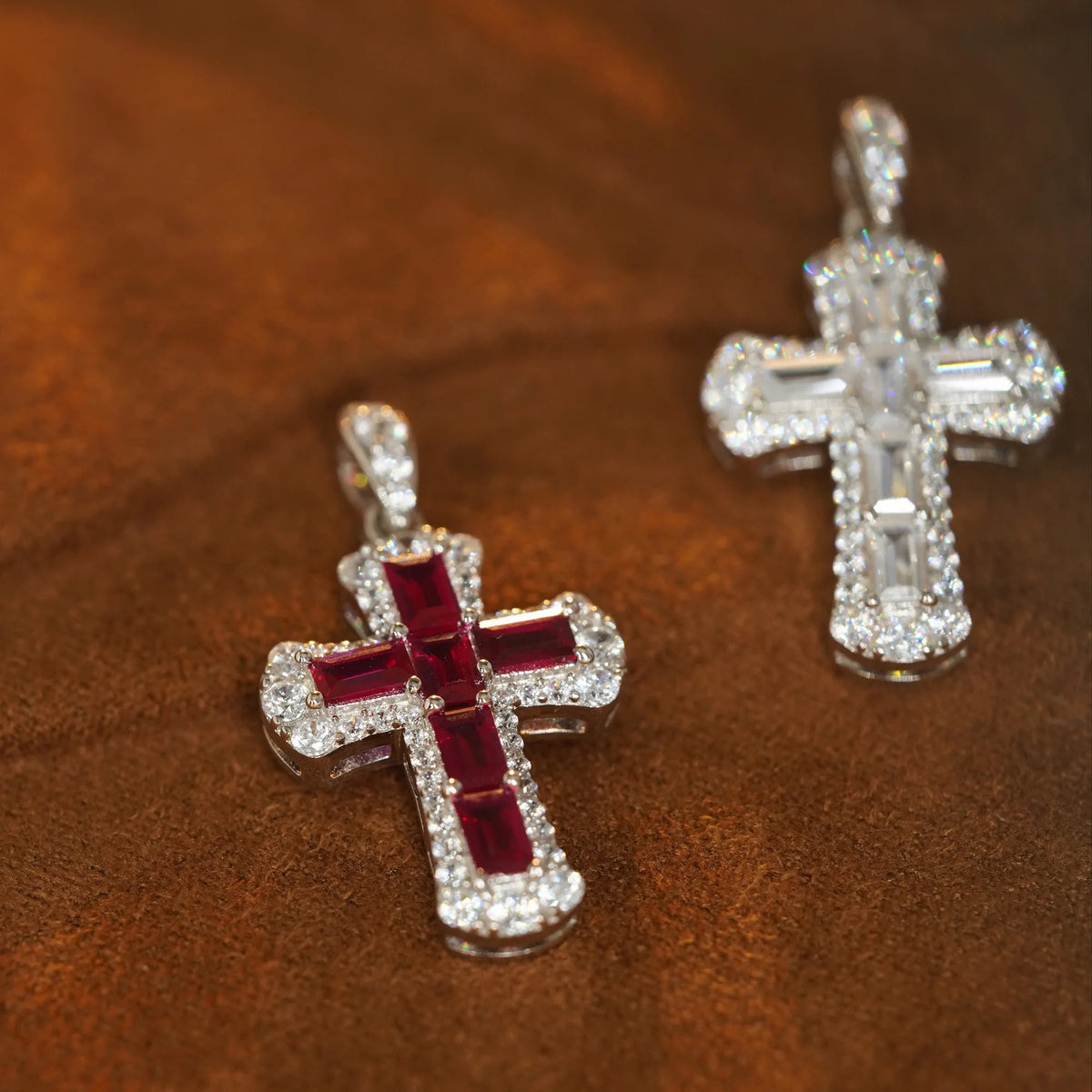 Red and white baguette-cut cubic zirconia cross pendants in white gold-plated sterling silver