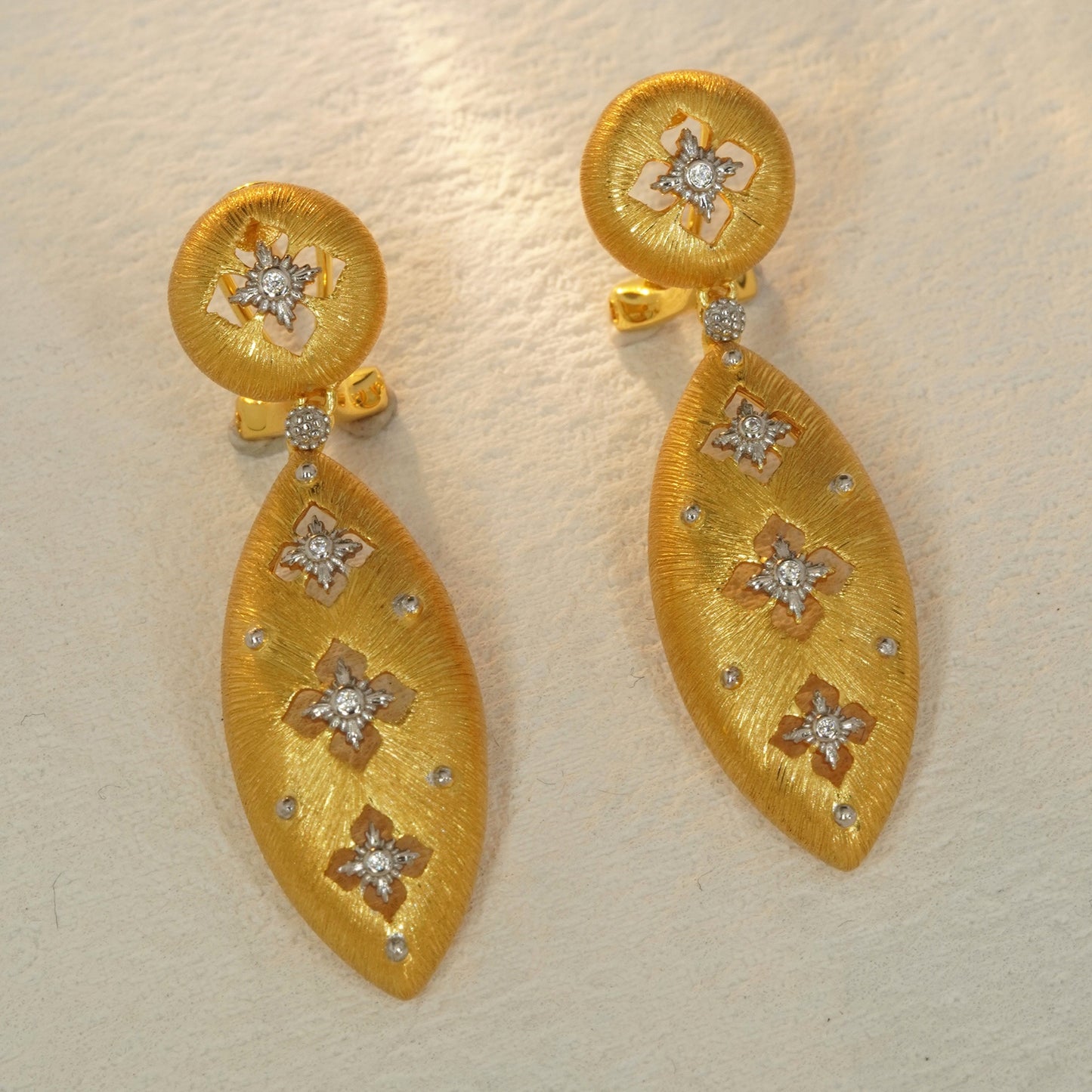 18K gold plated floral teardrop earrings with brushed texture and CZ accents