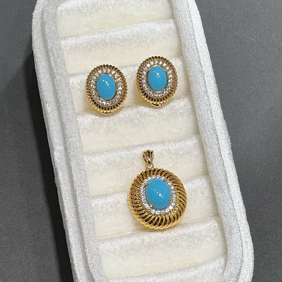 Azure Radiance created turquoise earring and pendant set in 18K gold plated sterling silver
