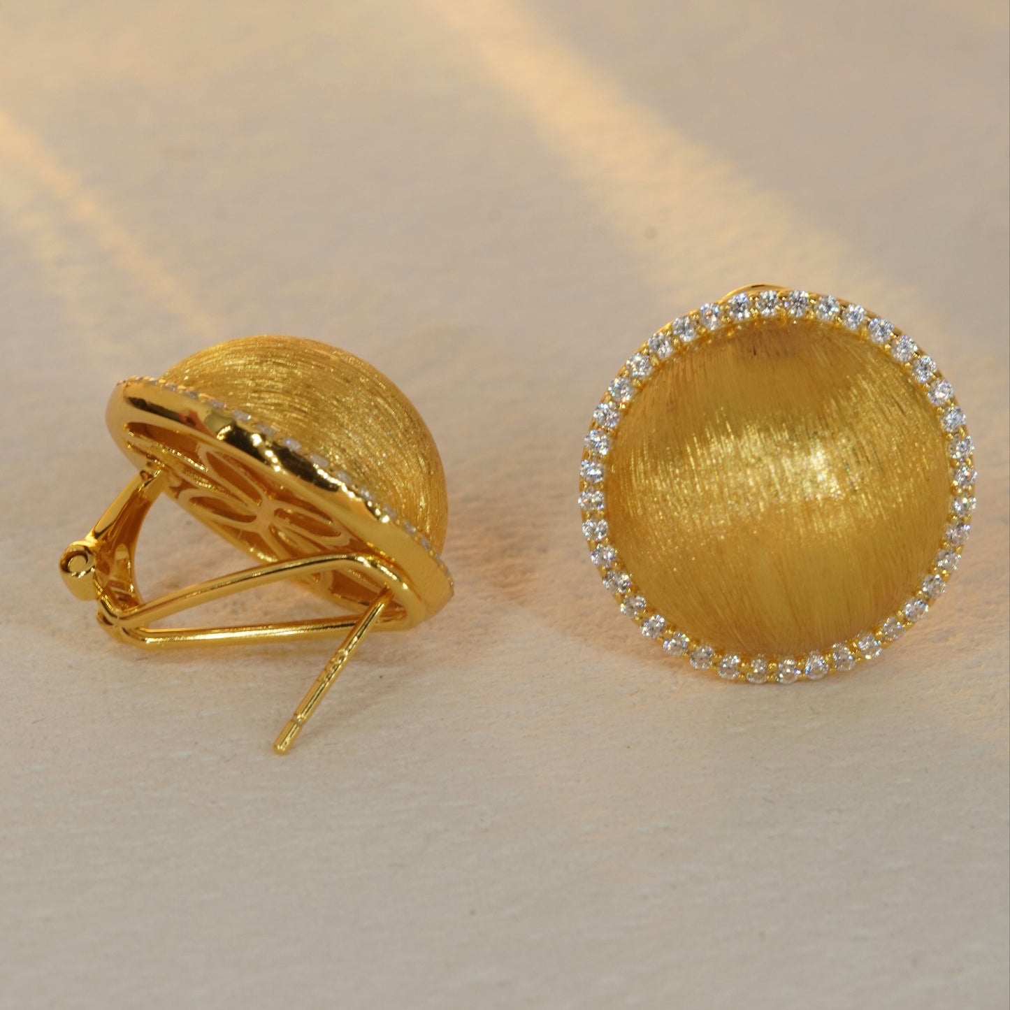 18K gold plated round stud earrings showing brushed texture and sterling silver craftsmanship