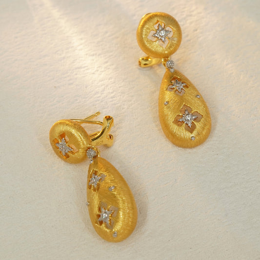 Brushed gold floral drop earrings with sterling silver base and hinged closure