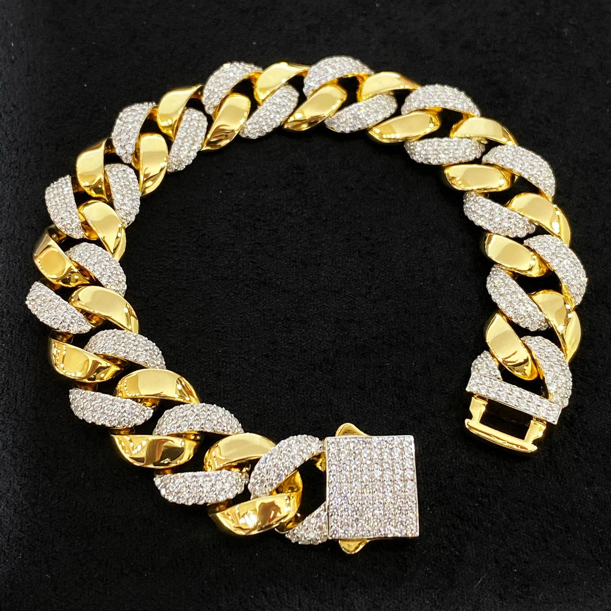 Two-tone Cuban link bracelet with alternating polished and 5A cubic zirconia links