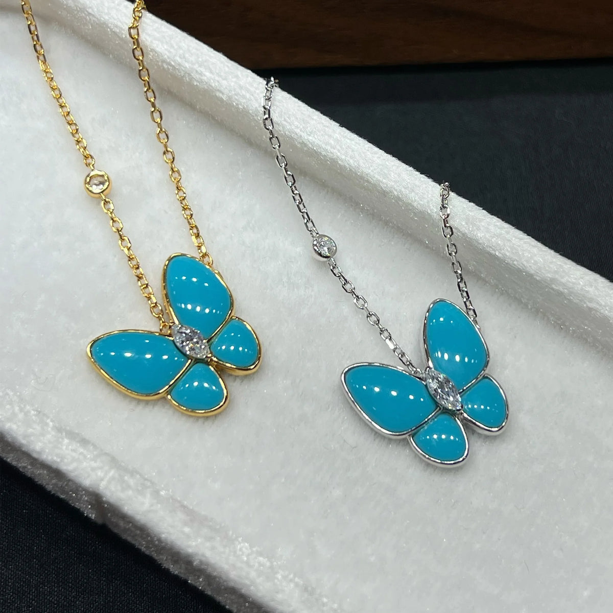 Sky blue created turquoise butterfly pendant necklace close-up