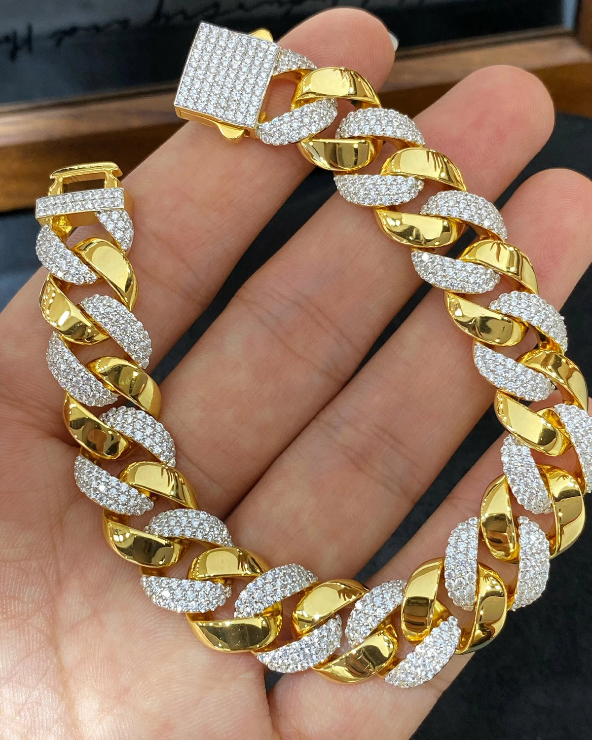 Close view of pave Cuban links and geometric box clasp