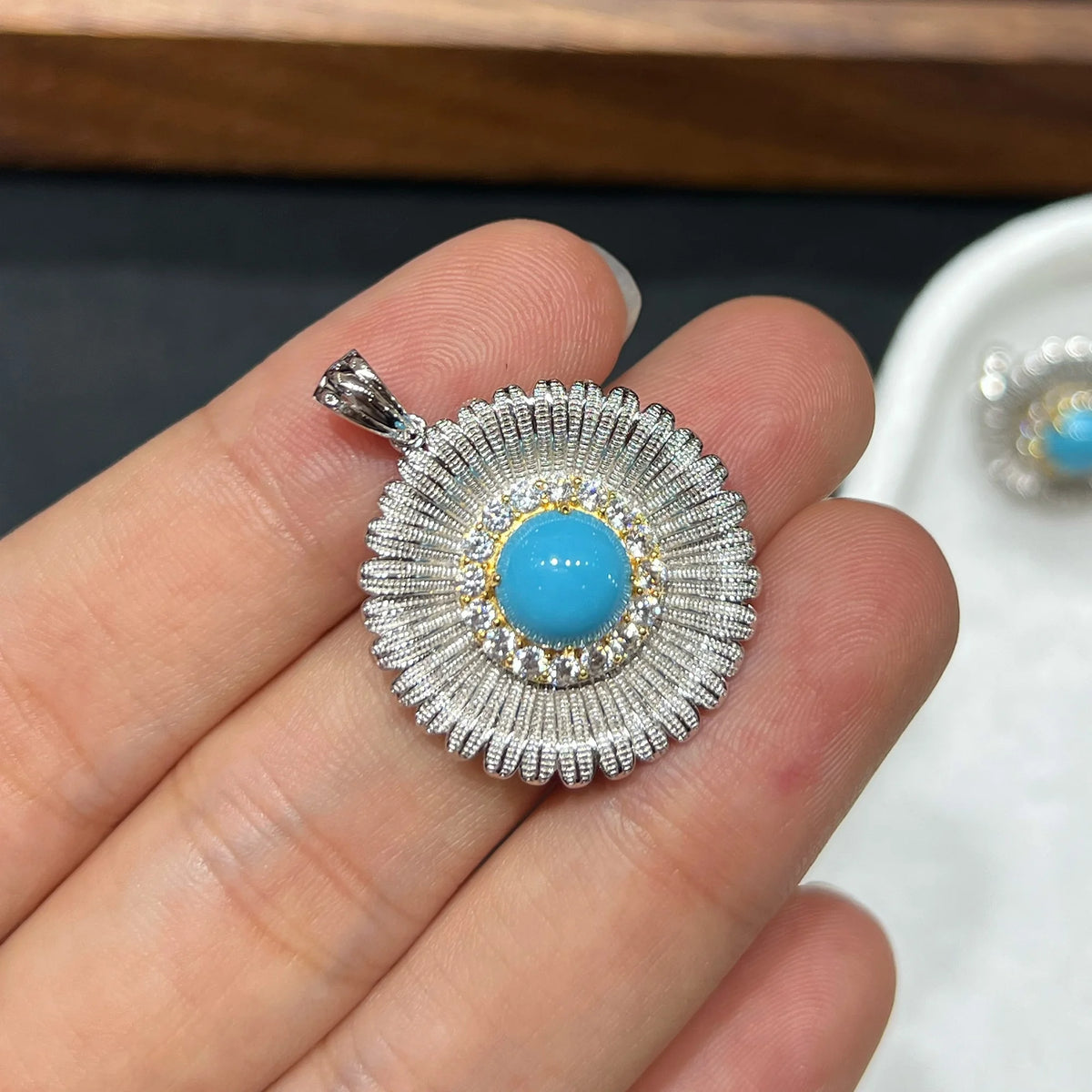 Vintage-inspired sunburst pierced earrings and pendant craftsmanship detail