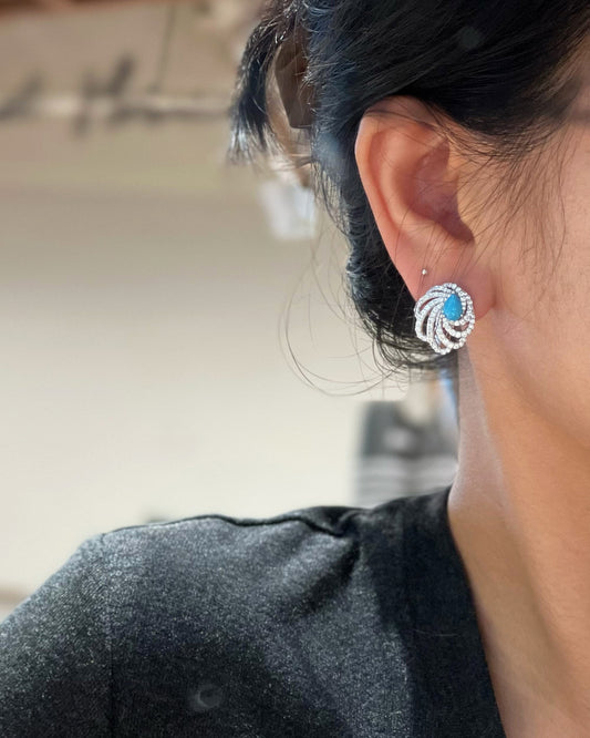 Turquoise Swirl Wing Stud Earrings on Ear - Noble Aurora