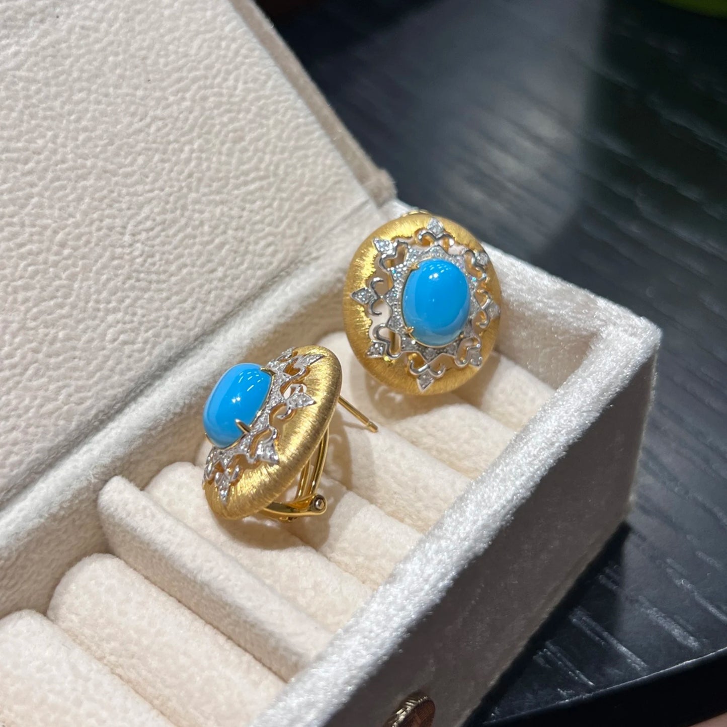side view of turquoise stud earrings with push back closure