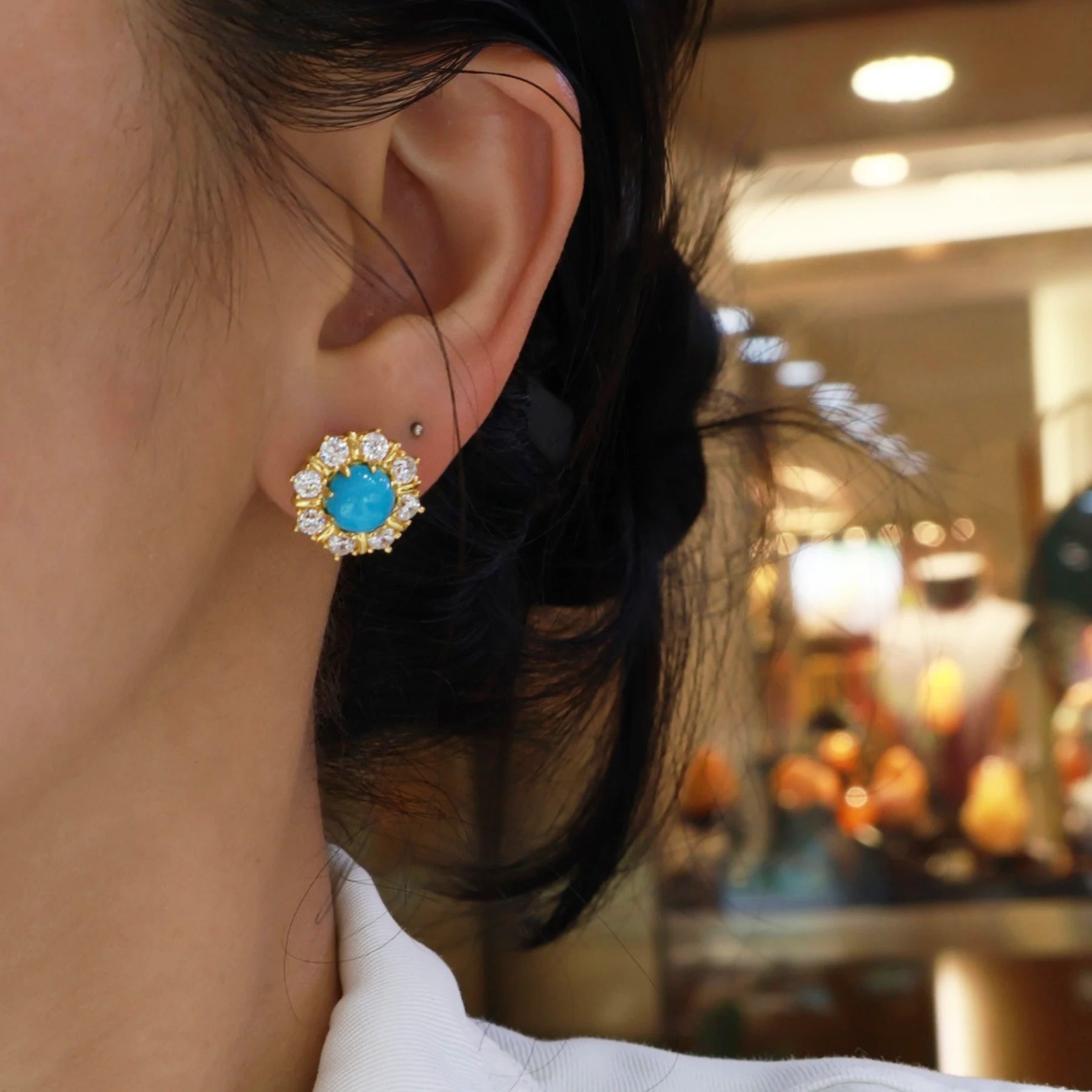 woman wearing blue turquoise gold halo stud earrings elegant vintage style