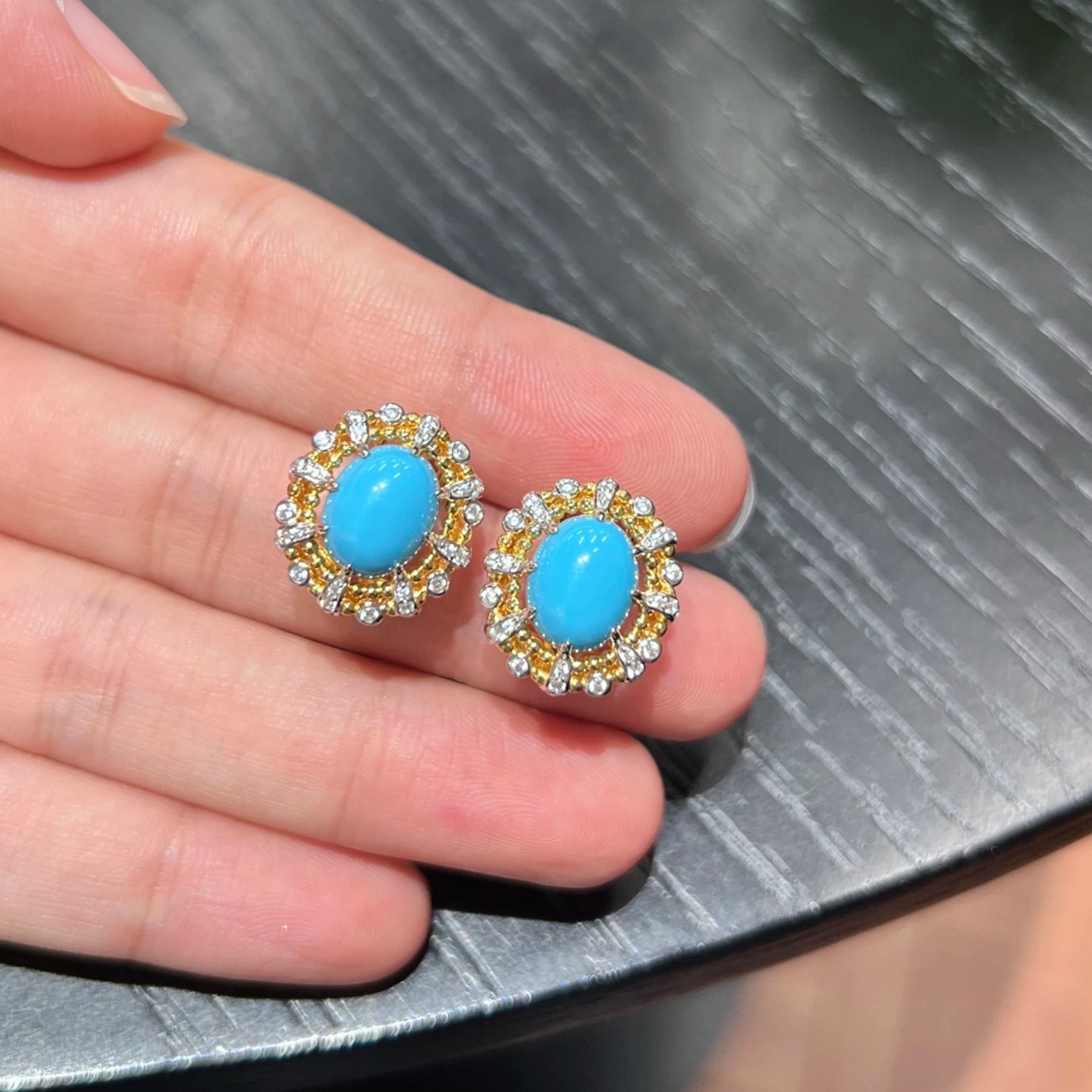 close up blue created turquoise gemstone earrings with crystal halo detail