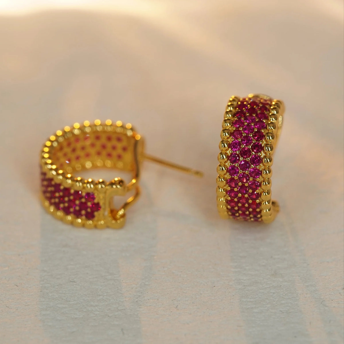 Gold red CZ beaded-edge hoop earrings, front and closure view