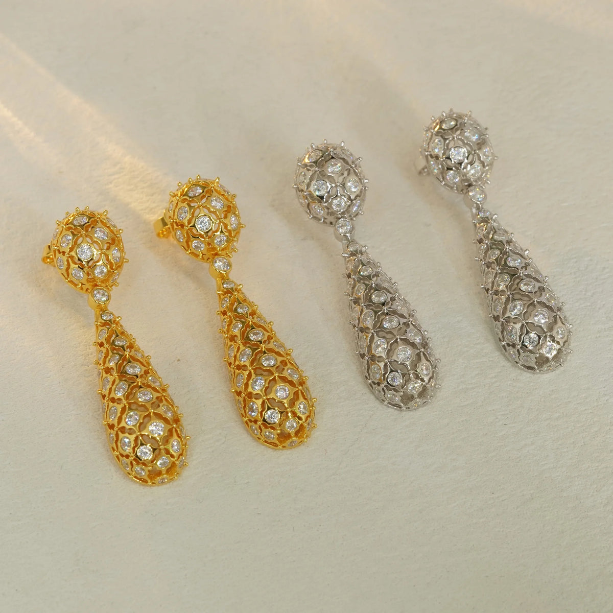 Gold and silver openwork floral pavé CZ drop earrings