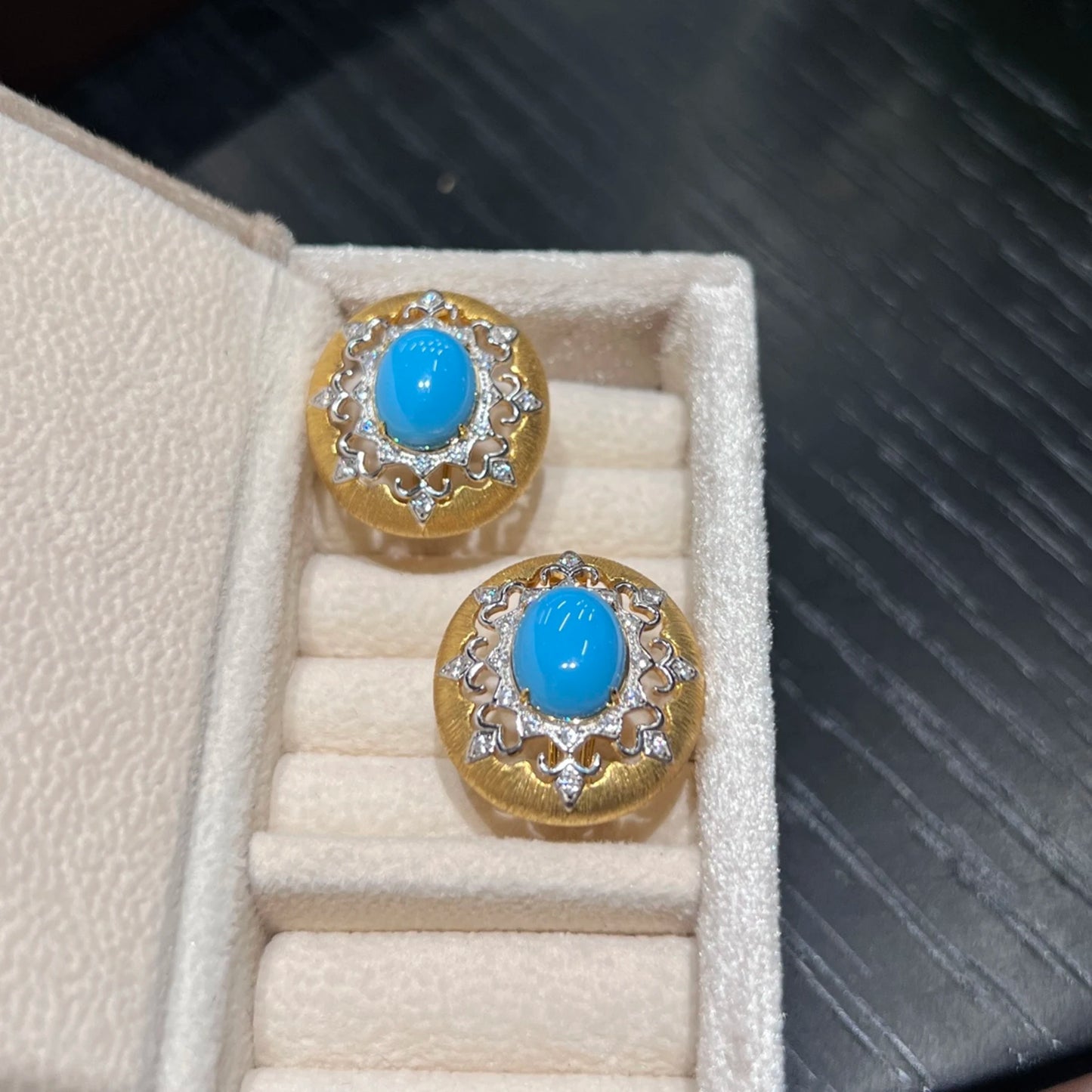 blue created turquoise earrings displayed in luxury jewelry box