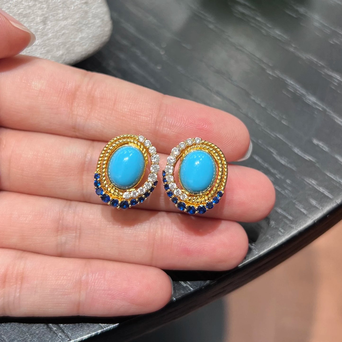 close up of blue created turquoise vintage halo earrings with gemstone details