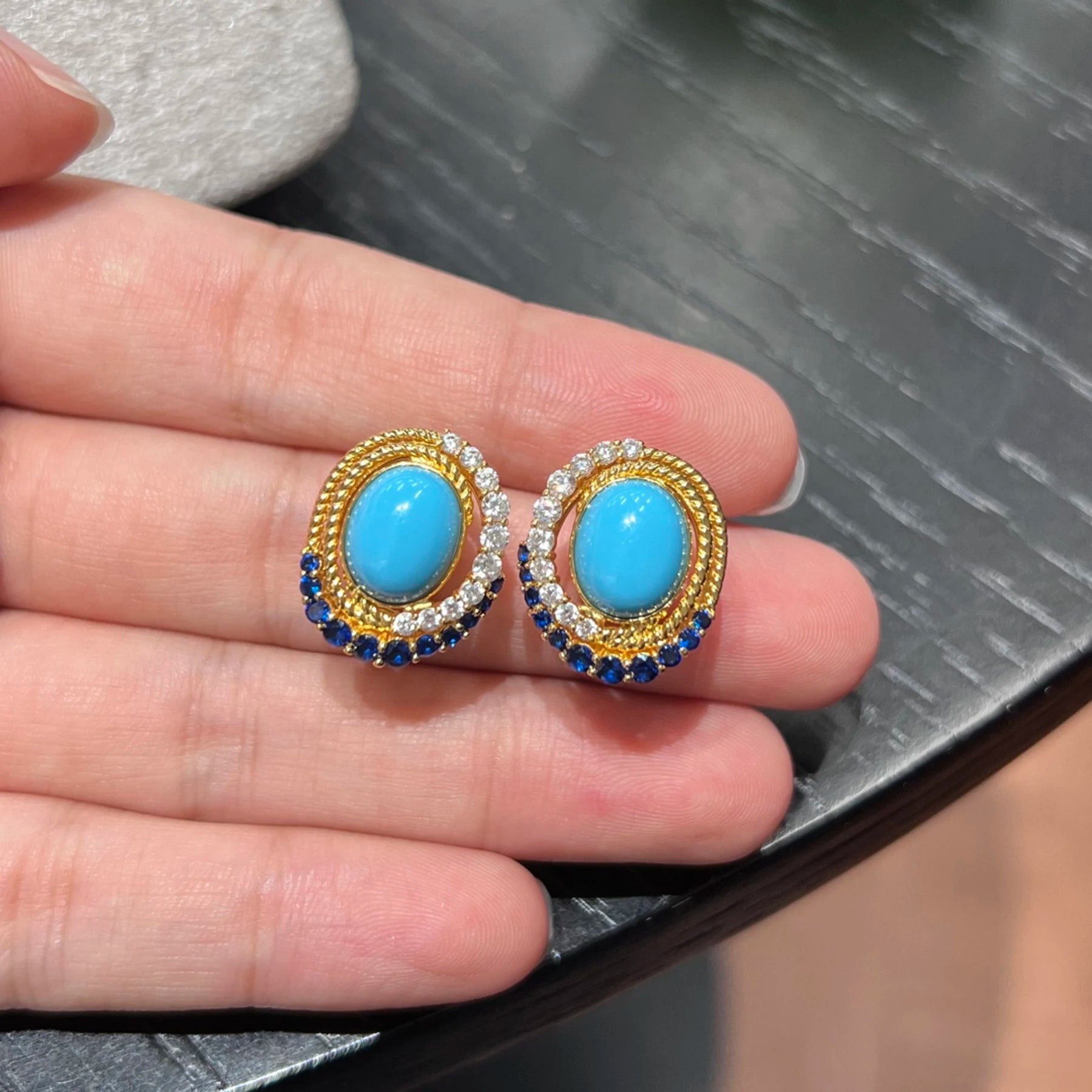 close up of blue created turquoise vintage halo earrings with gemstone details