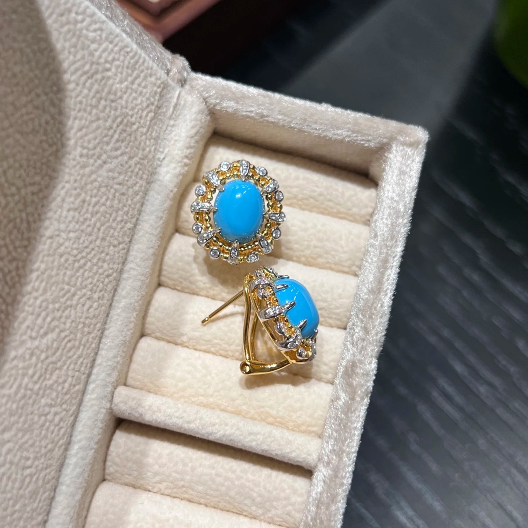 side view of sterling silver created turquoise stud earrings with push back closure