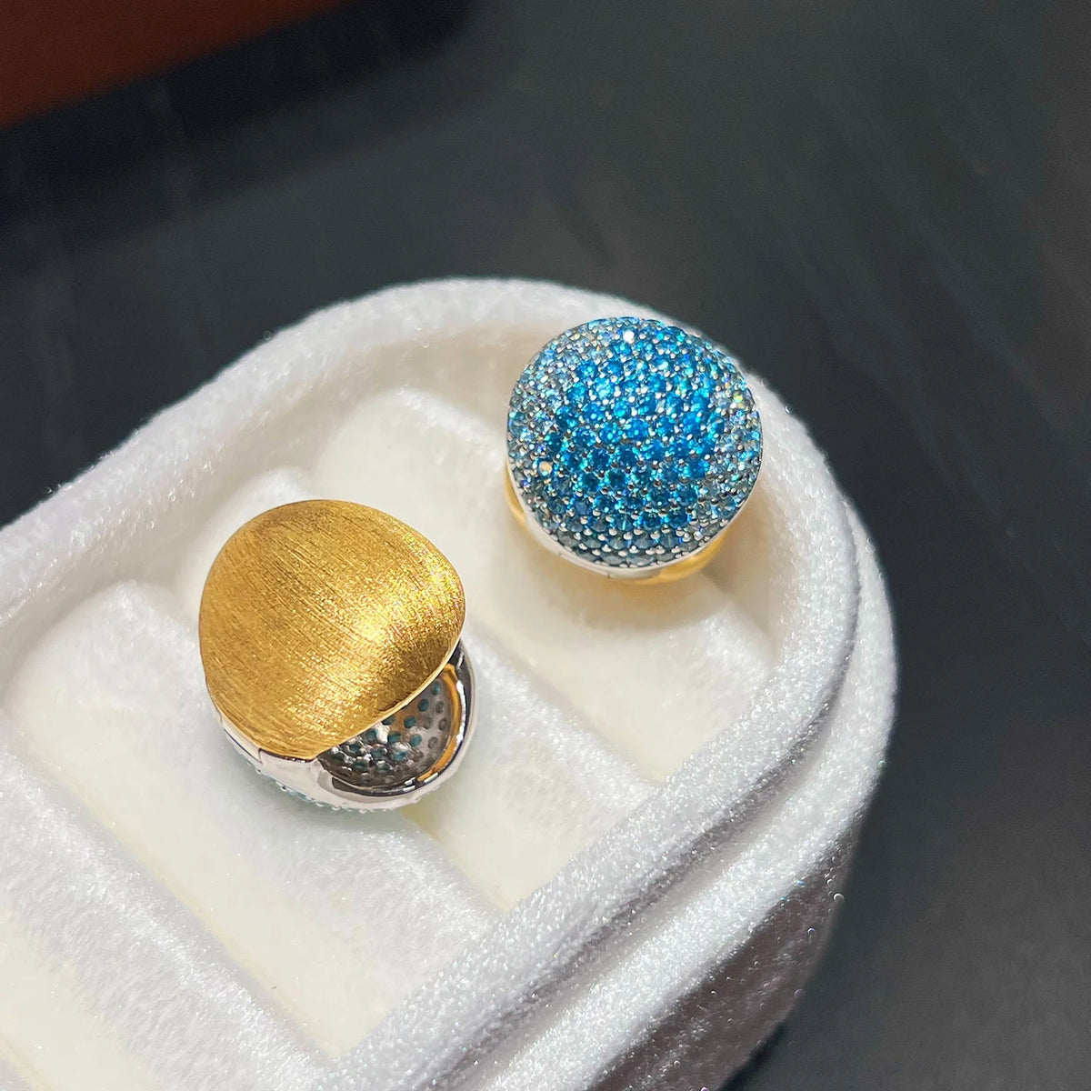 Reversible blue CZ huggie hoop earrings with 18K gold plated sterling silver design